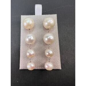 Graduated dangling pearl earrings in sterling silver